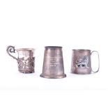 Two Continental silver tankards from Ethiopia and Pakistan, together with an Eastern white metal