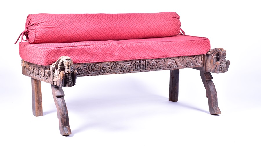A late 19th / early 20th century Indian carved hardwood bench the detailed frieze and terminus