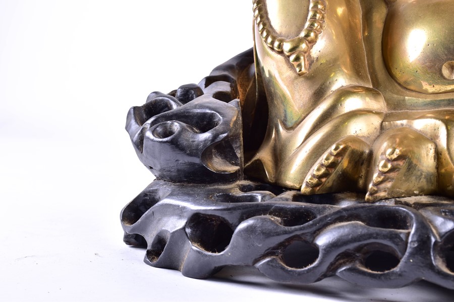 A large early 20th century Chinese brass figure of Hotei seated on a bespoke carved harwood stand, - Image 3 of 7