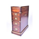 A 20th century campaign style brass bound hardwood Davenport writing desk the hinged front opening