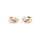 Cartier. A pair of  18ct tri-coloured gold ear clips signed and numbered C 49990, stamped 750.