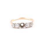 An 18ct yellow gold and diamond ring set with graduated old-cut diamonds (centre stone lacking),