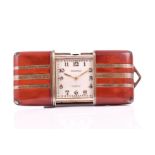A 1920s Movado Ermeto silver gilt and red enamel purse watch the white dial with applied gilt