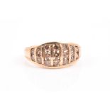 A 9ct yellow gold and cognac diamond ring the rounded band inset with nineteen bar-set round