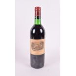 A bottle of Chateau Lafite Rothschild 1979 a Bordeaux red blend from Pauillac, 31 cm high.