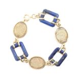 An unusual yellow metal and lapis lazuli bracelet comprised of three open rectangular lapis links,