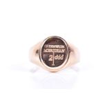 A 9ct yellow gold gents signet ring the oval mount engraved 'Greenwich Meridian 2000', size V, 6.4