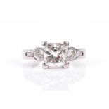 A platinum and diamond ring set with a princess-cut diamond of approximately 1.70 carats,
