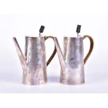 A pair of early 20th century silver cafe-au-lait pots Birmingham 1909 and 1917, by Mappin & Webb,