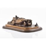 A 1984 limited edition lost wax cast bronze model of an M.G.T.C sports car mounted to a walnut