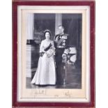 An autopen signed black and white presentation photograph of Queen Elizabeth II and Prince Philip,