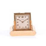 Cartier. An 18ct yellow and white gold purse watch of rectangular form, the case engraved to
