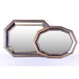 Two reproduction metal-framed mirrors each of shaped oval form with panelled glass, the largest 80