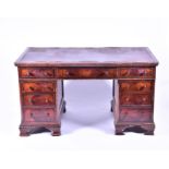 An Edwardian mahogany nine drawer pedestal desk with leather scriber, 77 cm x 137 cm x 76 cm.