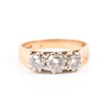An 18ct yellow gold and diamond ring set with three graduated stones of approximately 1.0 carat