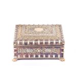 A 19th century Anglo-Indian jewellery box with tortoiseshell veneer and ivory mounts, the cover