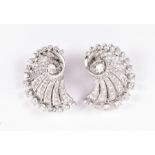 A fine pair of early to mid 20th century French 18ct white gold and diamond earrings of swirled