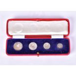 A George V 1929 Maundy Money four-coin set rev crowned denomination dividing date within wreath,