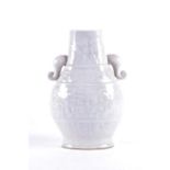 A 20th century celadon crackle glaze vase of hu form, the pear shaped body with moulded handles,