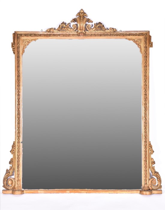 A large Victorian gilt-wood over mantle mirror of rectangular shape, with carved wood border,
