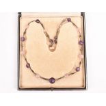 Sibyl Dunlop: A silver, faceted amethyst and rose quartz bead Arts & Crafts necklace attributed to