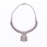 A white metal and diamond bib-style necklace possibly Eastern, set with round brilliant-cut diamonds