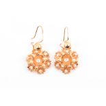 A pair of 14ct yellow gold and diamond floral cluster earrings each set with seven mixed-cut