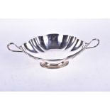 A George V twin-handled silver pedestal bowl of shaped, oval form, Birmingham 1929 by Hukin &