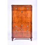 A 19th century French mahogany secretaire a abattant, with carved frieze above a single drawer and a