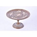 A Victorian bronze tazza decorated with moulded cherubs playing musical instruments in relief, and a