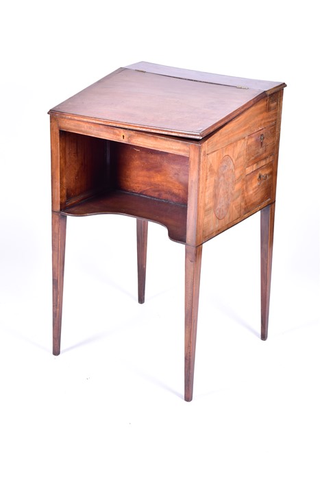 A George III 'Davenport' style writing desk of small proportions the sloping lid enclosing a bank of