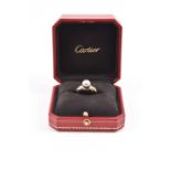 A modified 18 carat gold Cartier trinity ring with an added natural grey saltwater pearl  size L 1/