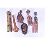 A group of 19th and 20th century carved Indian and African tribal wooden figures, relief panels