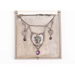An Art Nouveau white metal and enamel necklace suspended with a central heart-shaped pendant