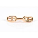 Hermes. An 18ct yellow gold Link brooch comprised of three set links, signed Hermes, Paris,