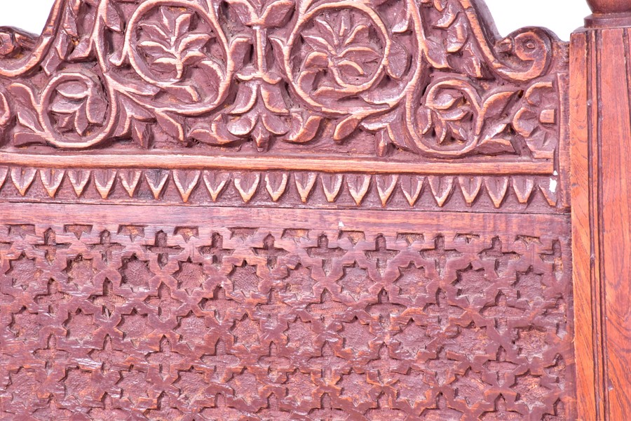 A pair of early 20th century Indian carved hardwood pida chairs, with rush seating, together with - Image 3 of 9