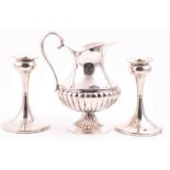 A pair of George V silver candlesticks Birmingham 1936, maker indistinct, 14 cm high, together