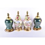 Two pairs of Vienna porcelain table lamps one pair white ground with flowers and classical scenes,