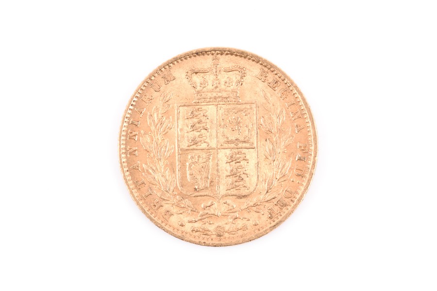 A Queen Victoria Young Head sovereign with shield back, dated 1861.