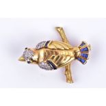 An unusual yellow gold, diamond, and sapphire bird brooch in the form of a bird, circa 1960s, with