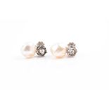 A pair of natural saltwater pearl and rose cut diamond earrings each set with a rose-cut diamond