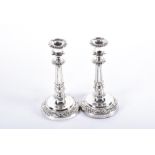 A pair of George III silver candlesticks by Matthew Boulton Birmingham 1821, with gadroon, shell and