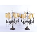 A pair of late 19th century French girandoles with central glass mounted stem holding six lights,