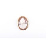 A late 19th / early 20th century cameo brooch the everted shell carved with a figure of a winged