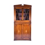 An Edwardian mahogany and inlaid library bookcase with astragal glazed top opening to reveal a