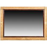 A Regency style giltwood wall mirror  the perimeter of the rectangular frame worked with Egyptian
