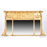 A late 19th and early 20th century horizontal trumeau mirror with plates in triptych, giltwood and