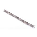 An articulated diamond bracelet  comprised of five rows of round-brilliant cut diamonds, of