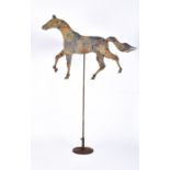 A 19th century iron articulated horse on stand fashioned as an advertising sign or weather vane