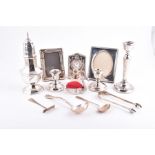 A small collection of miscellaneous silver to include a silver mounted desk clock, a pair of
